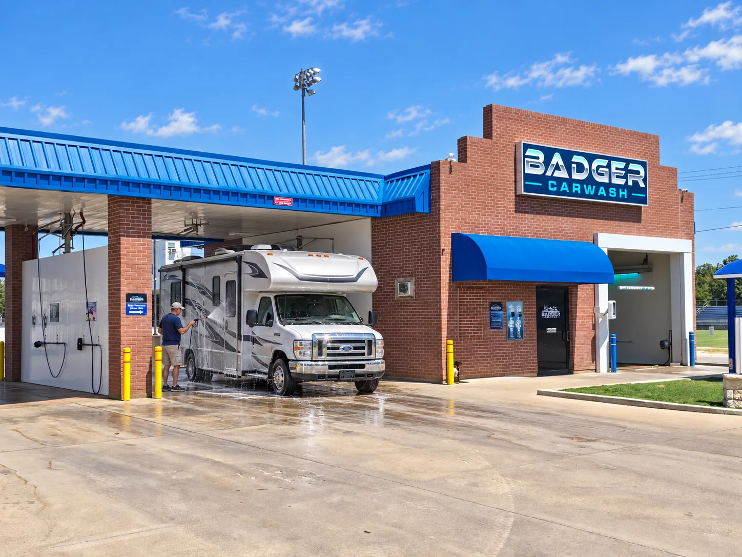 Customer pressure-washing a motorhome in the oversized bay at Badger Carwash in Lampasas.